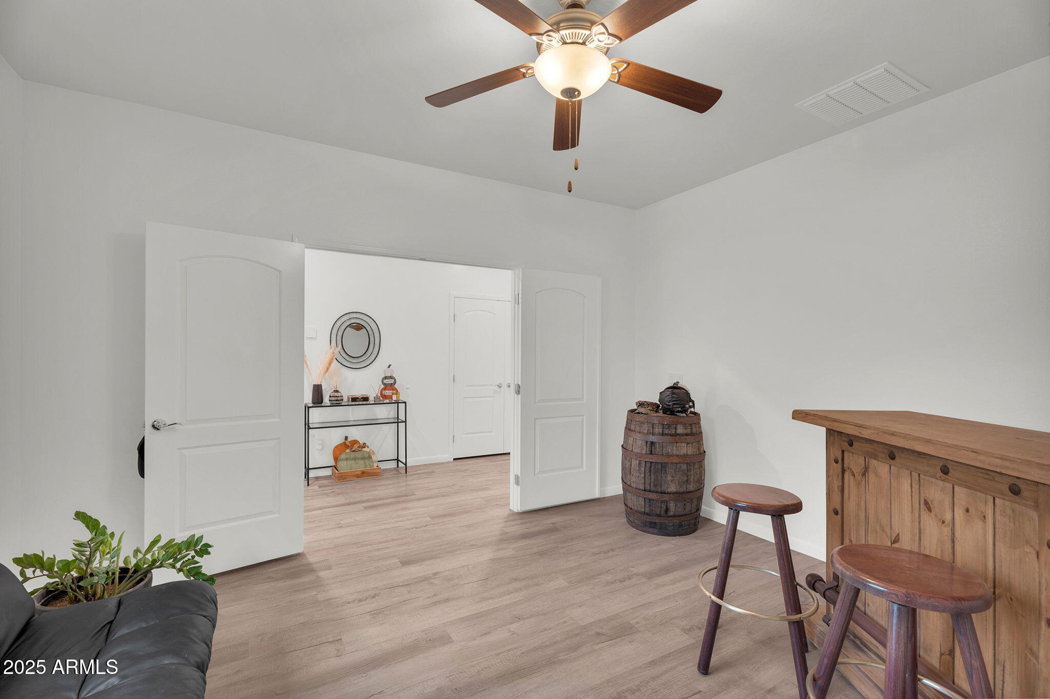 6579 West Georgetown Way Florence, AZ 85132 - Photo 8 of 60 a living room with furniture and a wooden floor