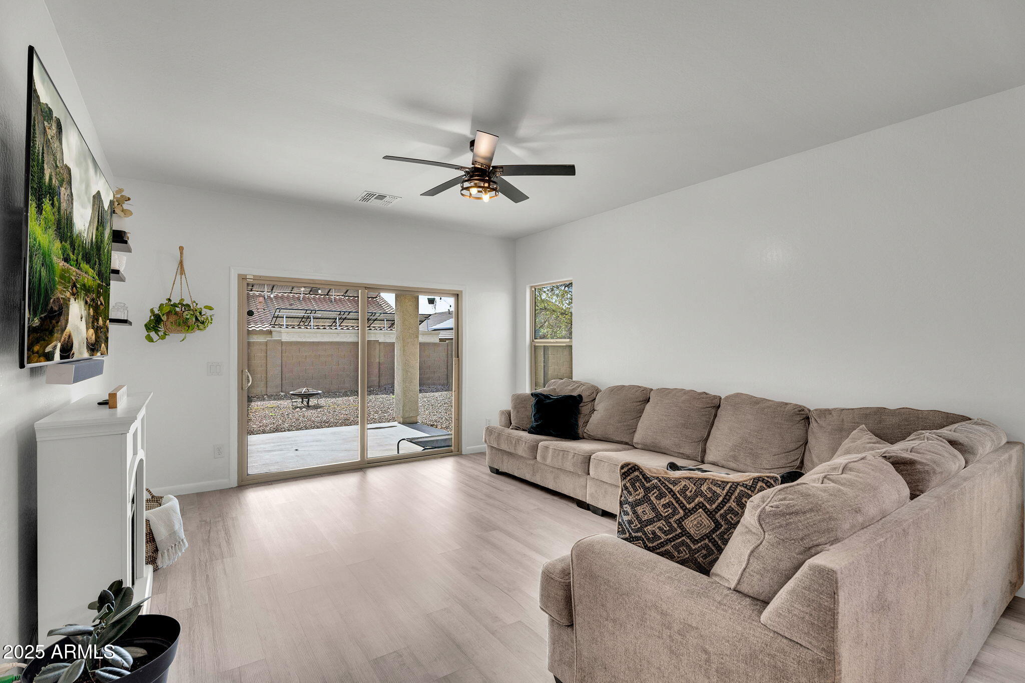 6579 West Georgetown Way Florence, AZ 85132 - Photo 10 of 60 a living room with furniture and a flat screen tv