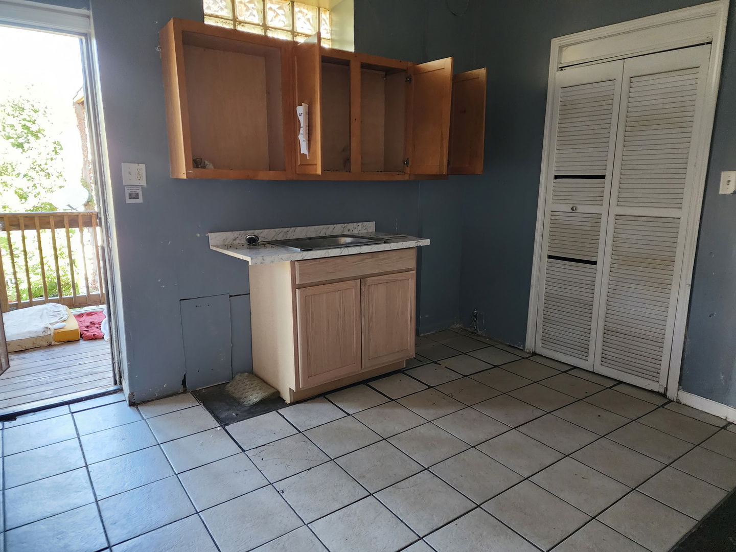 5718 South Green Street Chicago, IL 60621 - Photo 2 of 17 a utility room with cabinets