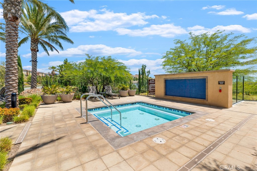 20717 Pine Cone Circle Porter Ranch, CA 91326 - Photo 11 of 31 a swimming pool with outdoor seating and yard