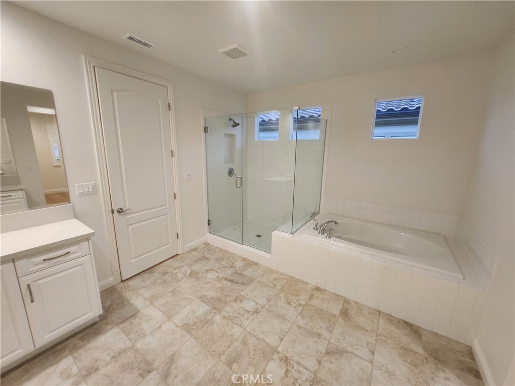 20717 Pine Cone Circle Porter Ranch, CA 91326 - Photo 13 of 31 a bathroom with a bathtub and a sink