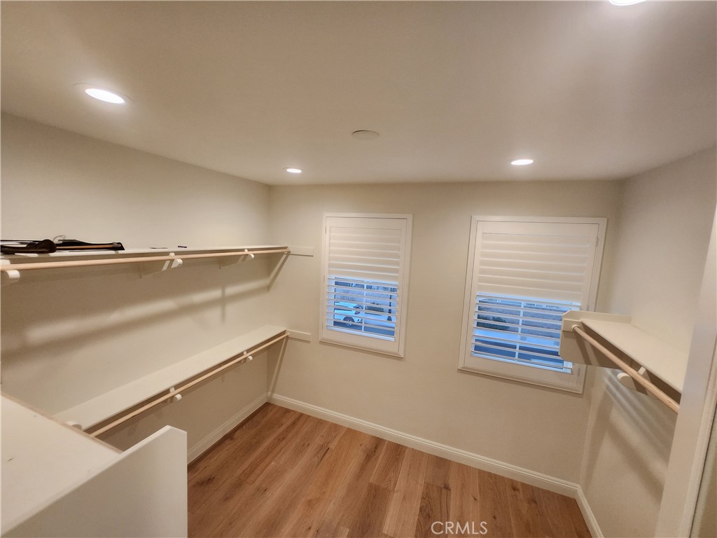 20717 Pine Cone Circle Porter Ranch, CA 91326 - Photo 14 of 31 a view of an empty room with windows