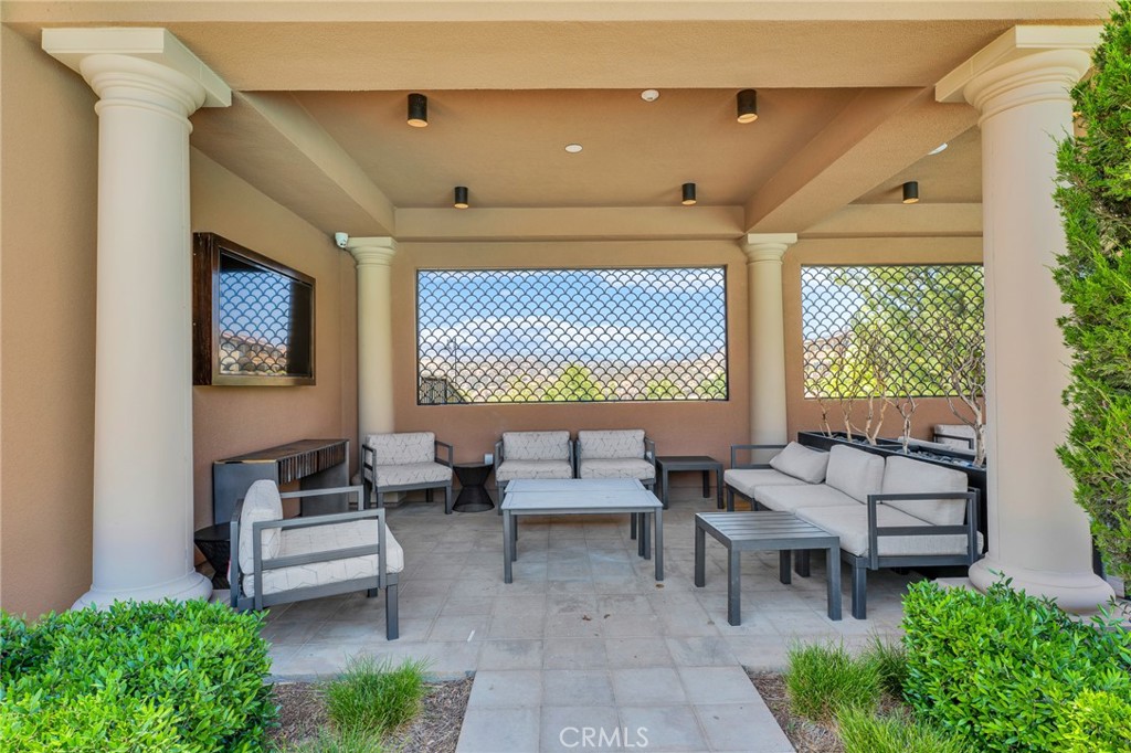 20717 Pine Cone Circle Porter Ranch, CA 91326 - Photo 15 of 31 a outdoor space with patio the couches and a potted plant