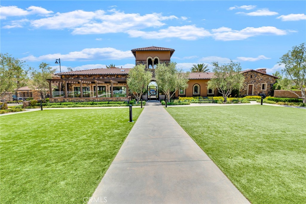 20717 Pine Cone Circle Porter Ranch, CA 91326 - Photo 22 of 31 a front view of a building with a garden