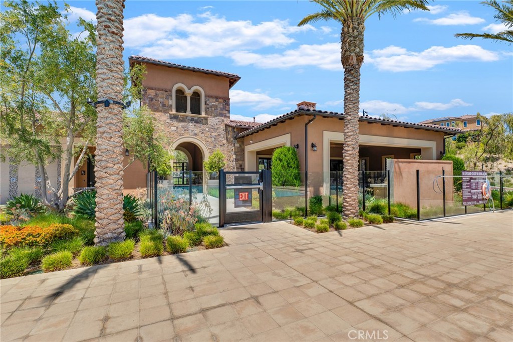 20717 Pine Cone Circle Porter Ranch, CA 91326 - Photo 24 of 31 a front view of a house with garden