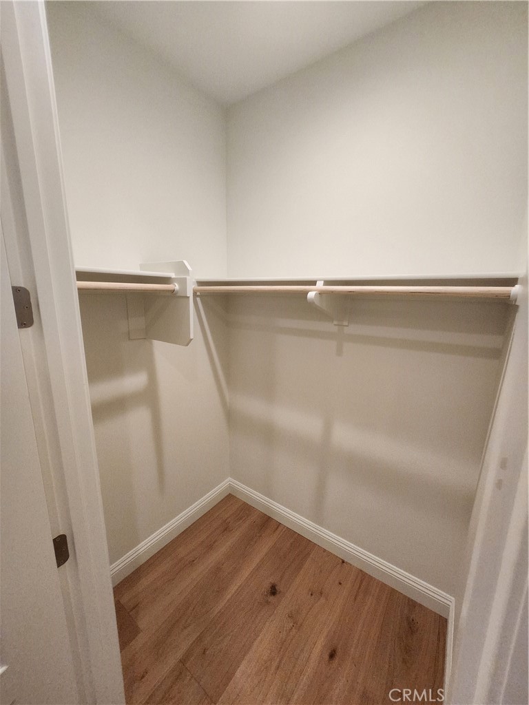 20717 Pine Cone Circle Porter Ranch, CA 91326 - Photo 30 of 31 a view of walk in closet with wooden floor