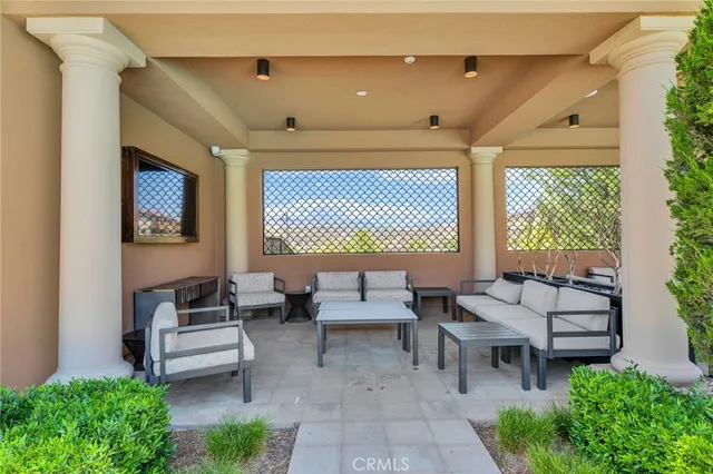 a view of swimming pool with palm trees