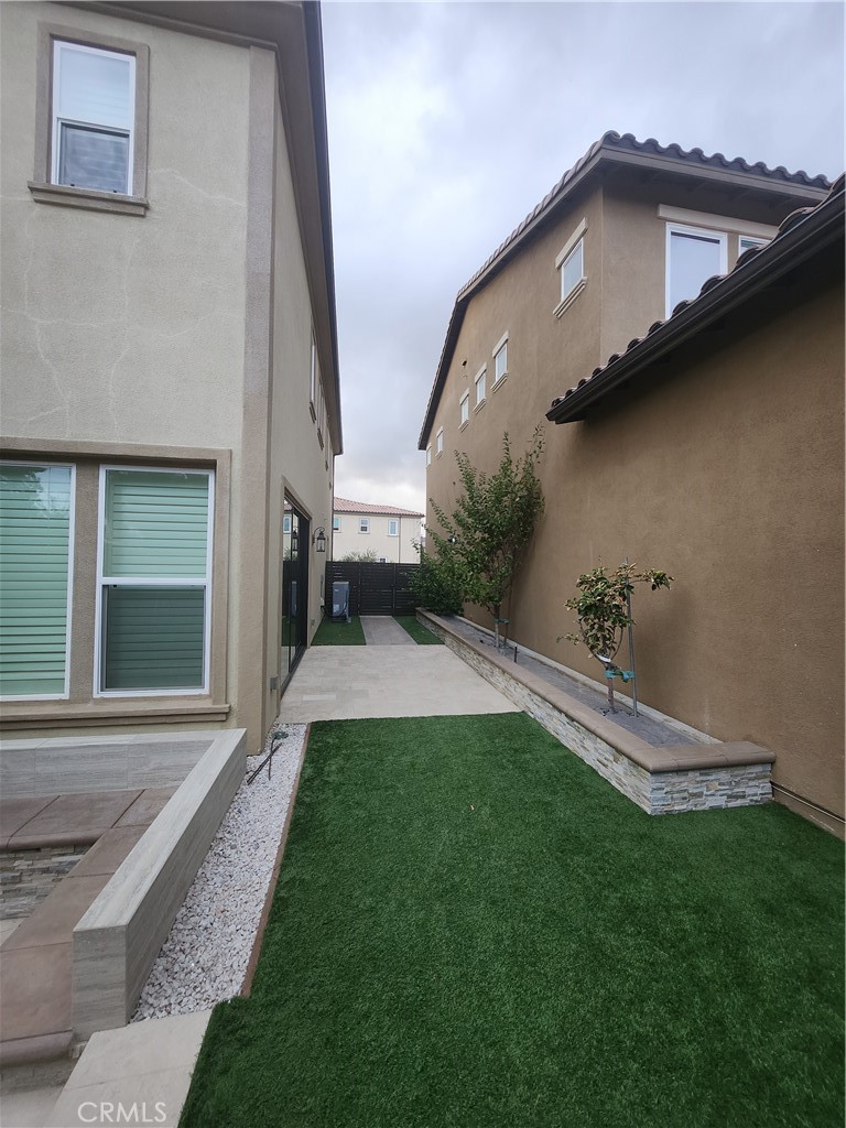 20717 Pine Cone Circle Porter Ranch, CA 91326 - Photo 4 of 31 a front view of a house with garden
