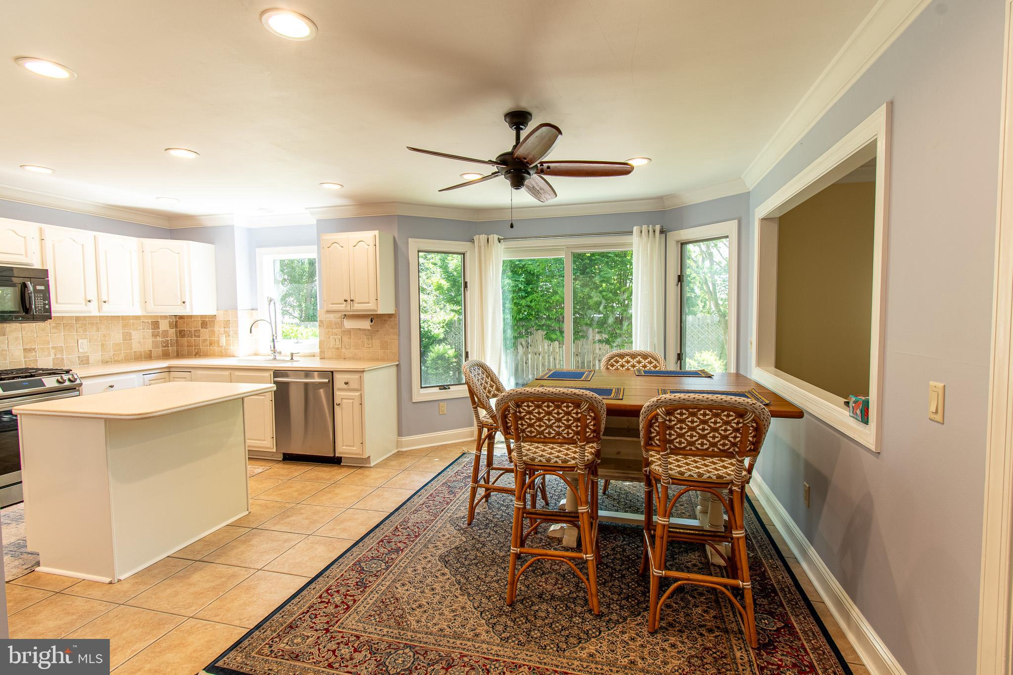 102 Jacks Point Road Oxford, MD 21654 - Photo 14 of 83 a dining room with stainless steel appliances a dining table and chairs
