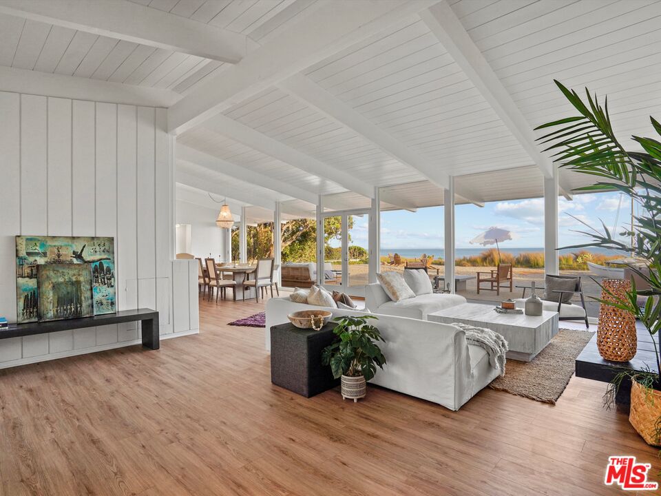 31284 Broad Beach Road Malibu, CA 90265 - Photo 1 of 31 a living room with lots of furniture and a large window