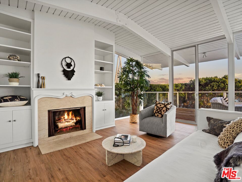 31284 Broad Beach Road Malibu, CA 90265 - Photo 14 of 31 a living room with furniture and a fireplace