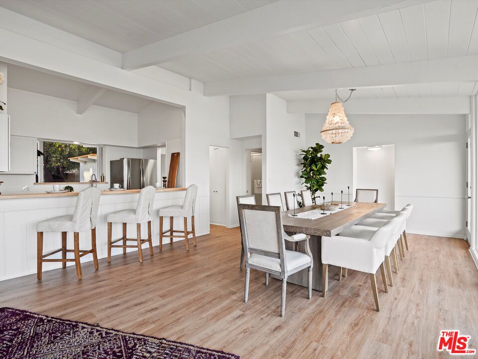 31284 Broad Beach Road Malibu, CA 90265 - Photo 10 of 31 a view of a dining room with furniture and wooden floor