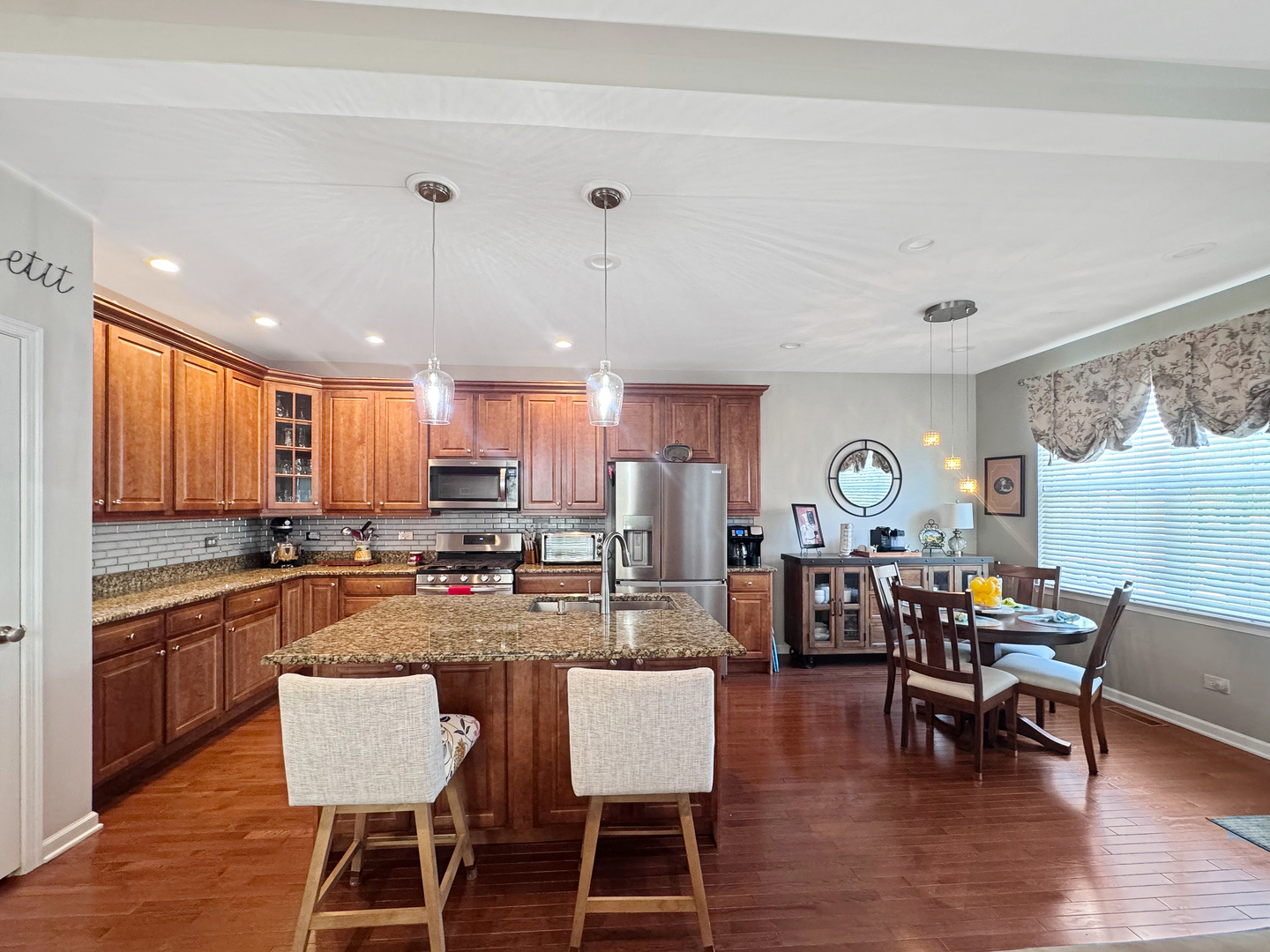 1210 Falcon Ridge Drive Elgin, IL 60124 - Photo 18 of 35 a large kitchen with a table and chairs