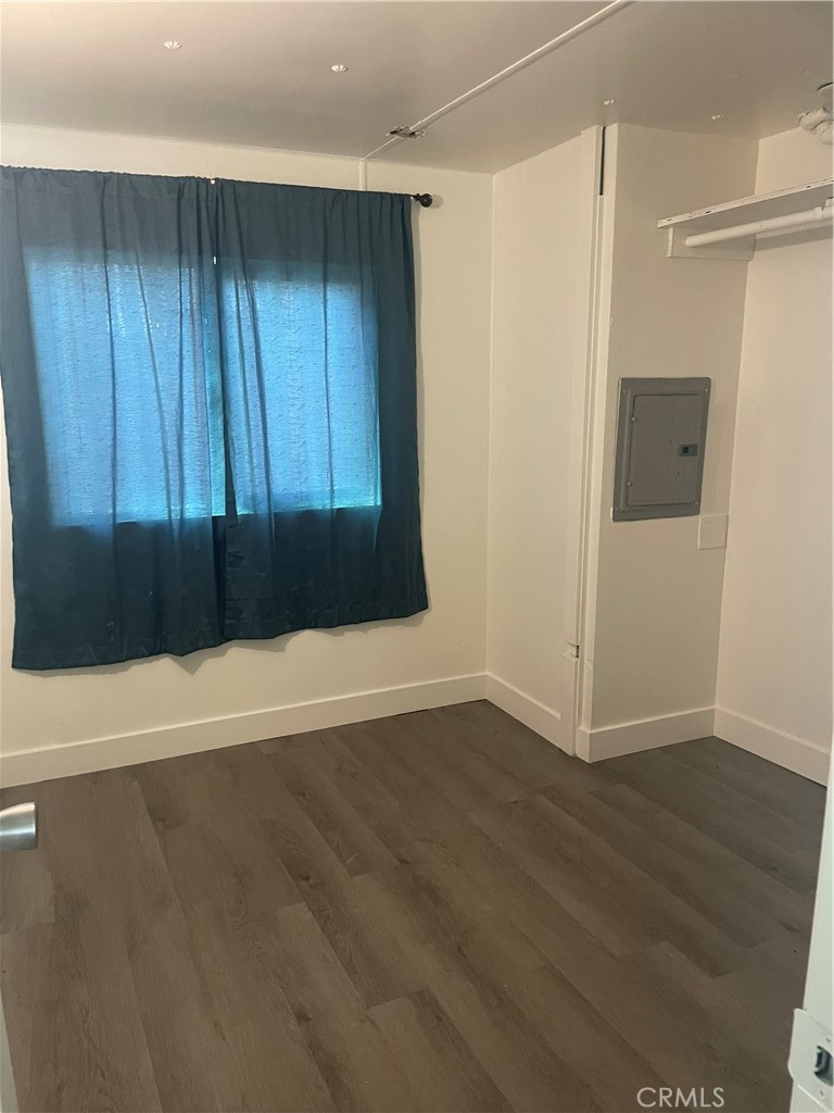 32802 Valle Road, Unit 135 San Juan Capistrano, CA 92675 - Photo 11 of 26 an empty room with wooden floor