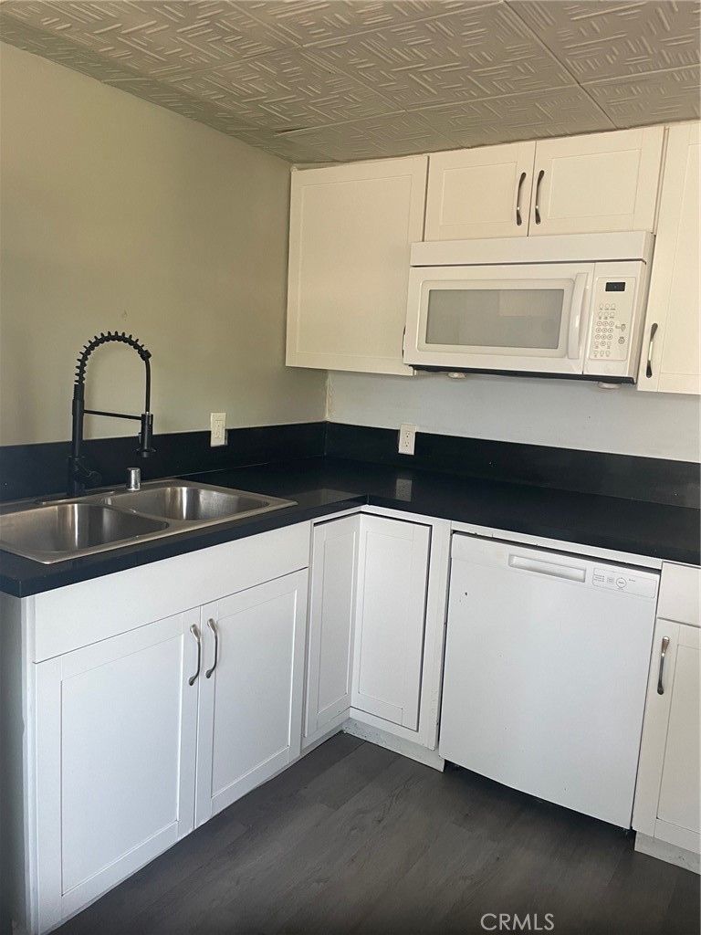 32802 Valle Road, Unit 135 San Juan Capistrano, CA 92675 - Photo 2 of 26 a close view of a sink and cabinets