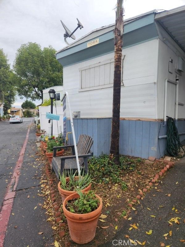 32802 Valle Road, Unit 135 San Juan Capistrano, CA 92675 - Photo 26 of 26 a front view of a house with garden