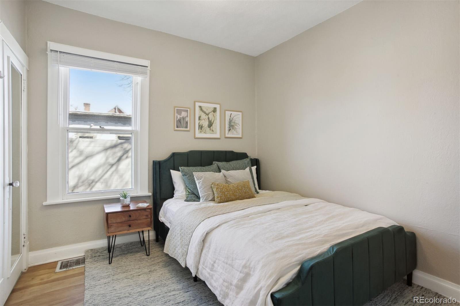 4138 Shoshone Street Denver, CO 80211 - Photo 16 of 27 a bedroom with a bed and a window