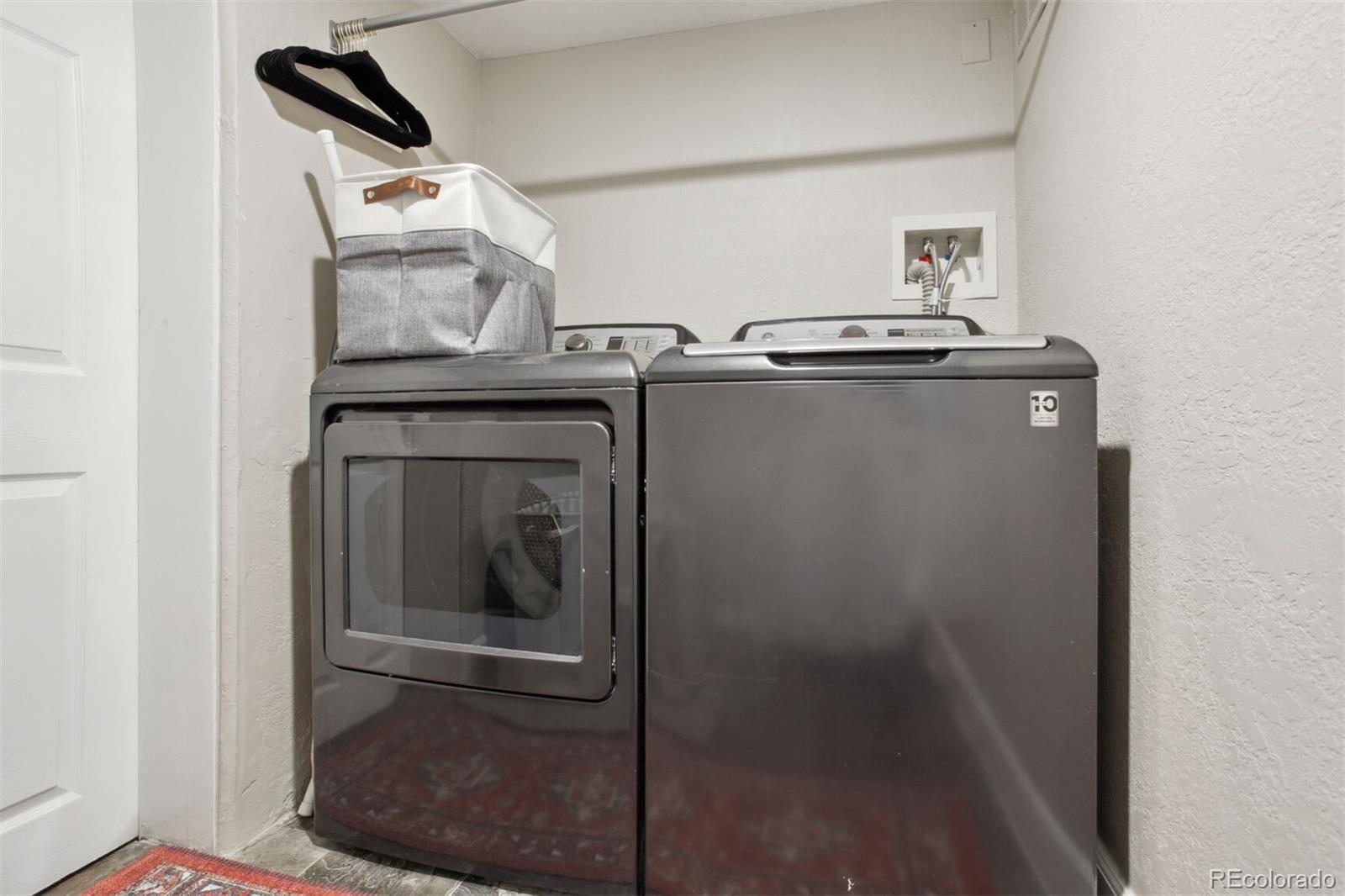 4138 Shoshone Street Denver, CO 80211 - Photo 25 of 27 a utility room with dryer and washer