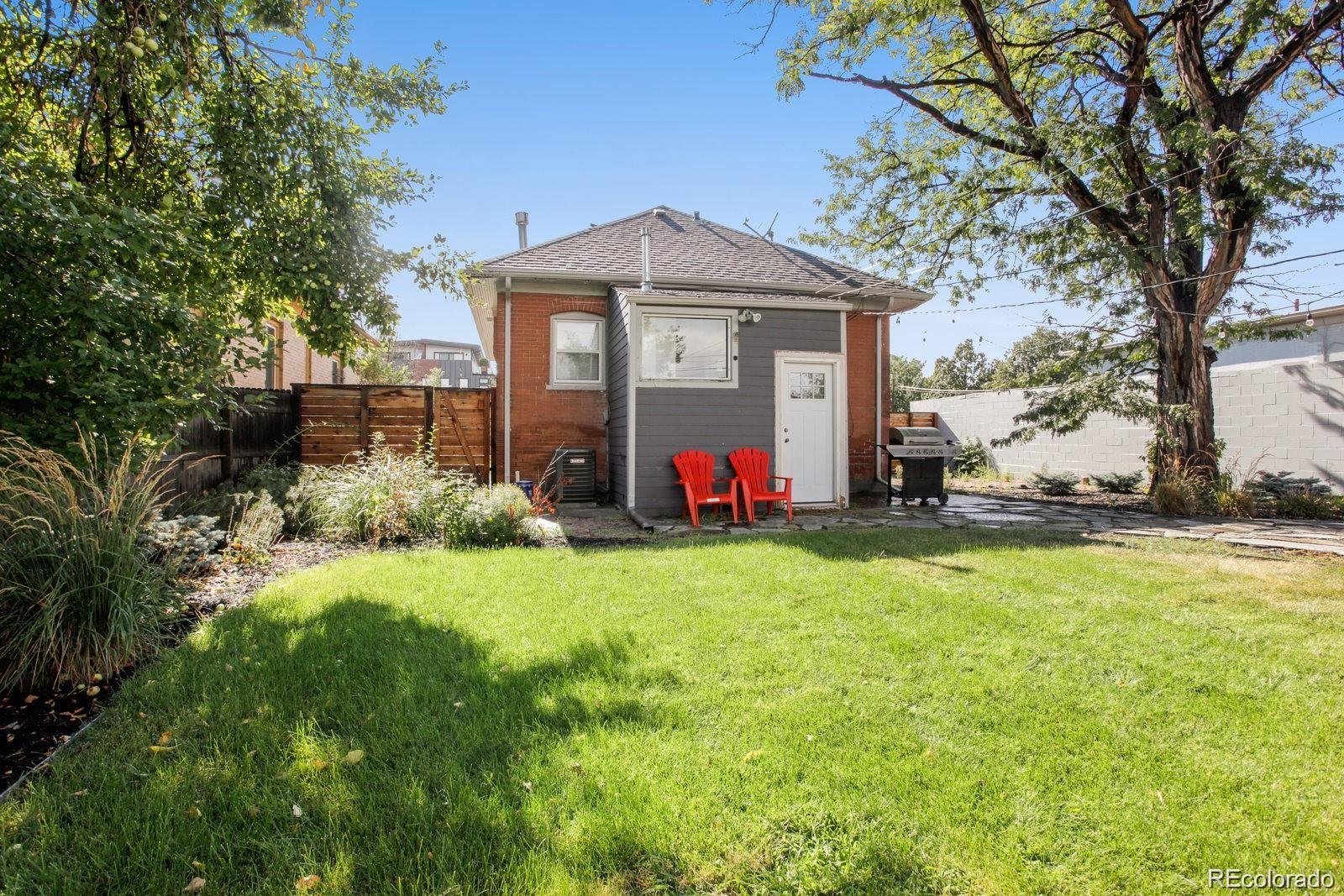 4138 Shoshone Street Denver, CO 80211 - Photo 27 of 27 a view of a house with backyard and garden