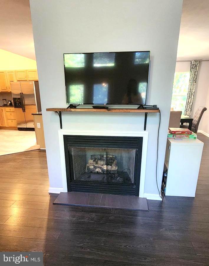 1112 Lee Road Basye, VA 22810 - Photo 13 of 102 a living room with a fireplace and a flat screen tv