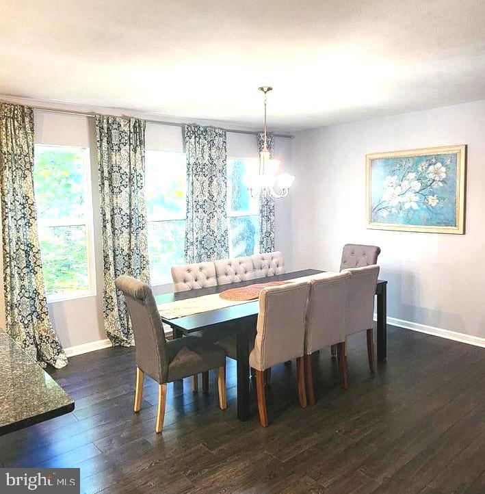 1112 Lee Road Basye, VA 22810 - Photo 14 of 102 a view of a dining room with furniture window and wooden floor