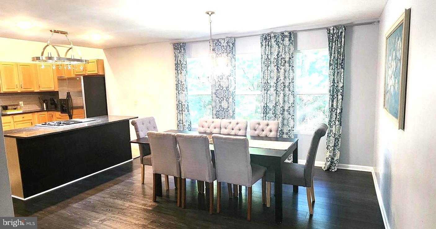 1112 Lee Road Basye, VA 22810 - Photo 16 of 102 a view of a dining room with furniture window and wooden floor