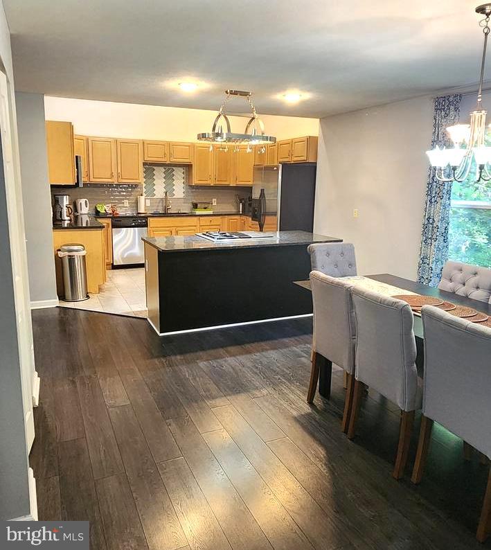 1112 Lee Road Basye, VA 22810 - Photo 18 of 102 a kitchen with a table chairs refrigerator and cabinets