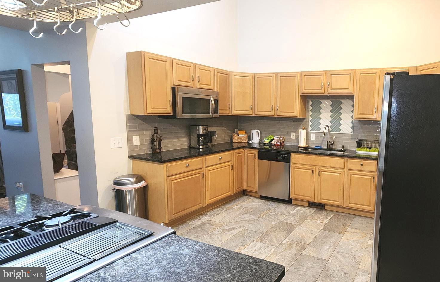 1112 Lee Road Basye, VA 22810 - Photo 21 of 102 a kitchen with stainless steel appliances granite countertop a refrigerator stove top oven and sink