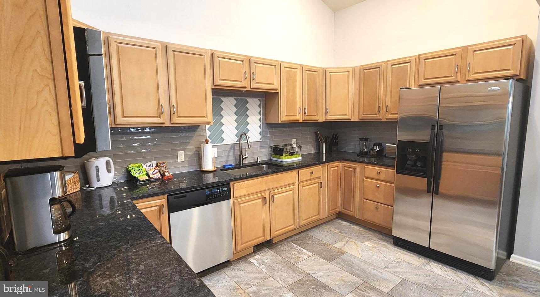 1112 Lee Road Basye, VA 22810 - Photo 22 of 102 a kitchen with stainless steel appliances granite countertop a refrigerator a stove and white cabinets