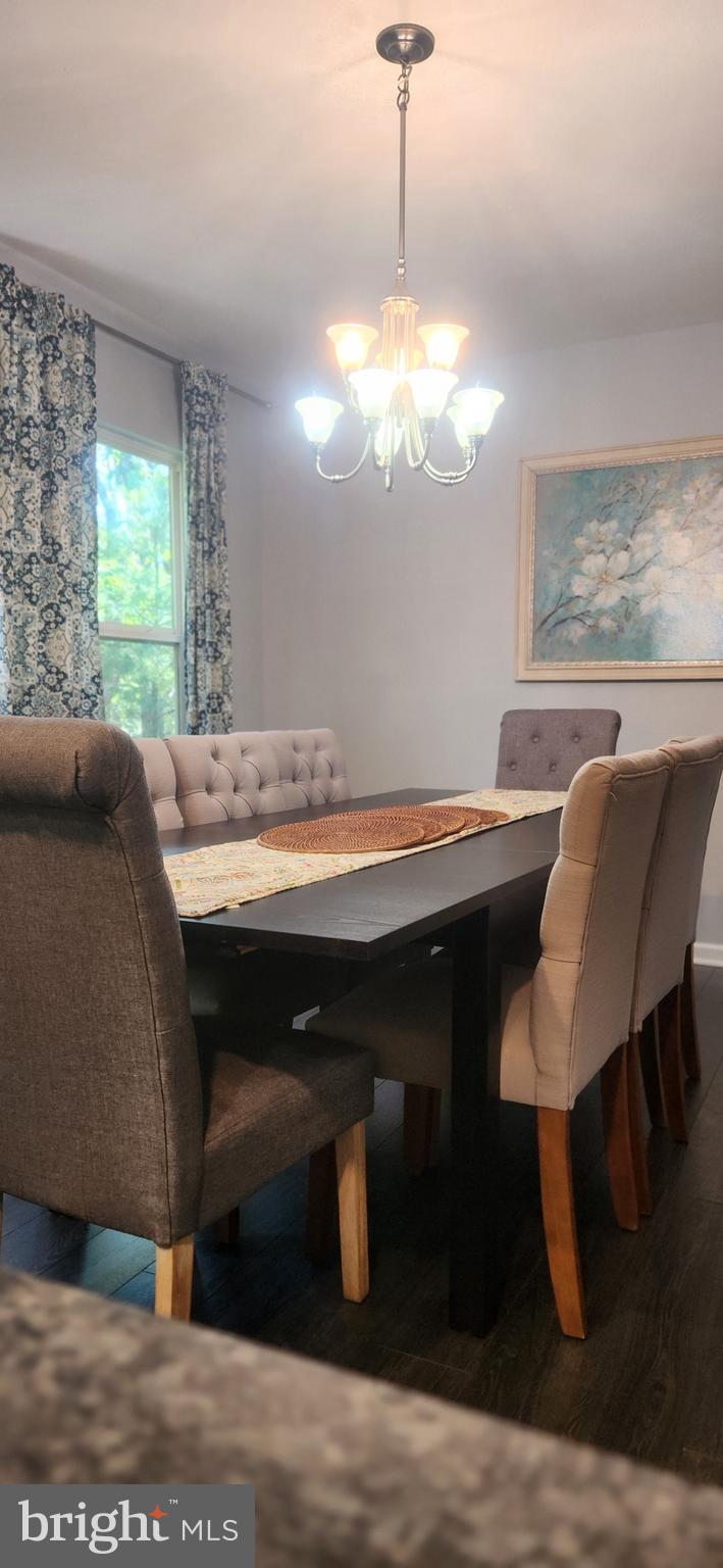 1112 Lee Road Basye, VA 22810 - Photo 26 of 102 a view of a dining room with furniture window and wooden floor