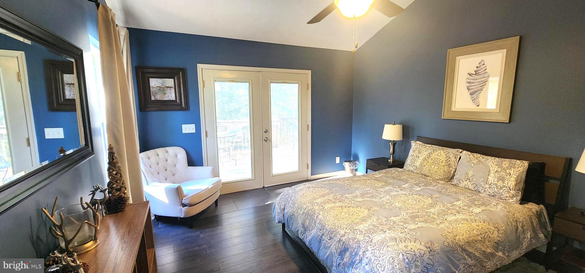 1112 Lee Road Basye, VA 22810 - Photo 28 of 102 a bed sitting in a bedroom next to a window