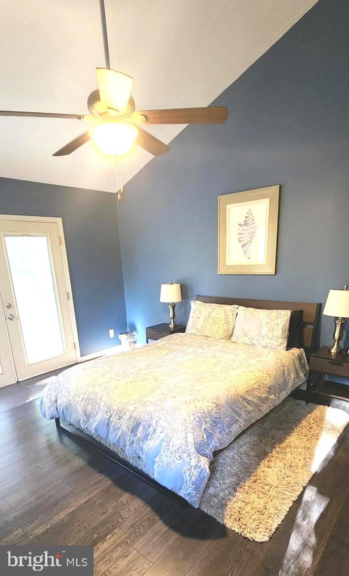 1112 Lee Road Basye, VA 22810 - Photo 29 of 102 a bedroom with a bed and a chandelier