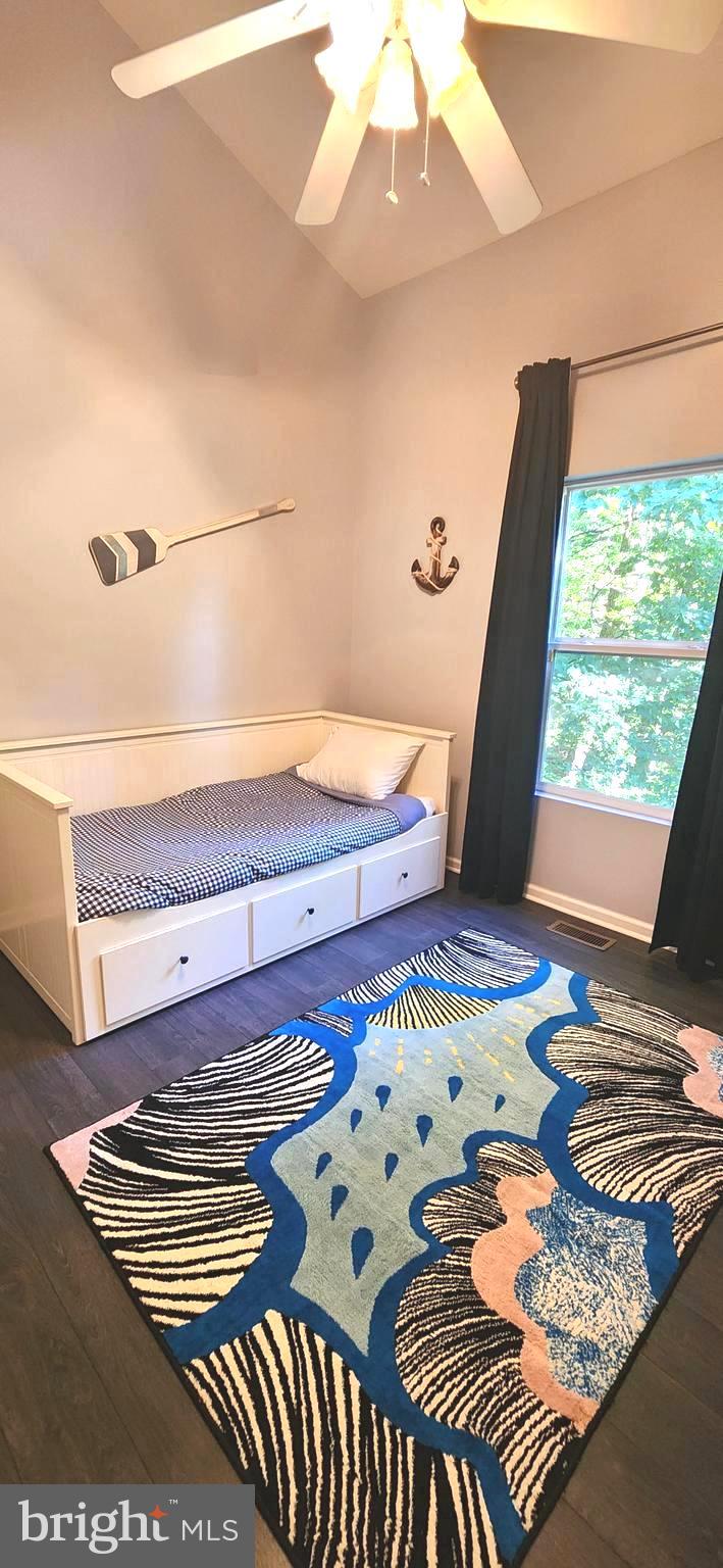 1112 Lee Road Basye, VA 22810 - Photo 39 of 102 a bedroom with a bed and wooden floor