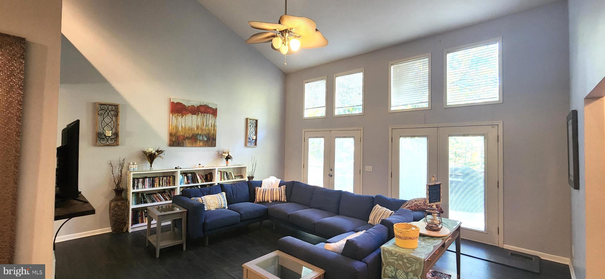1112 Lee Road Basye, VA 22810 - Photo 4 of 102 a living room with furniture and a chandelier