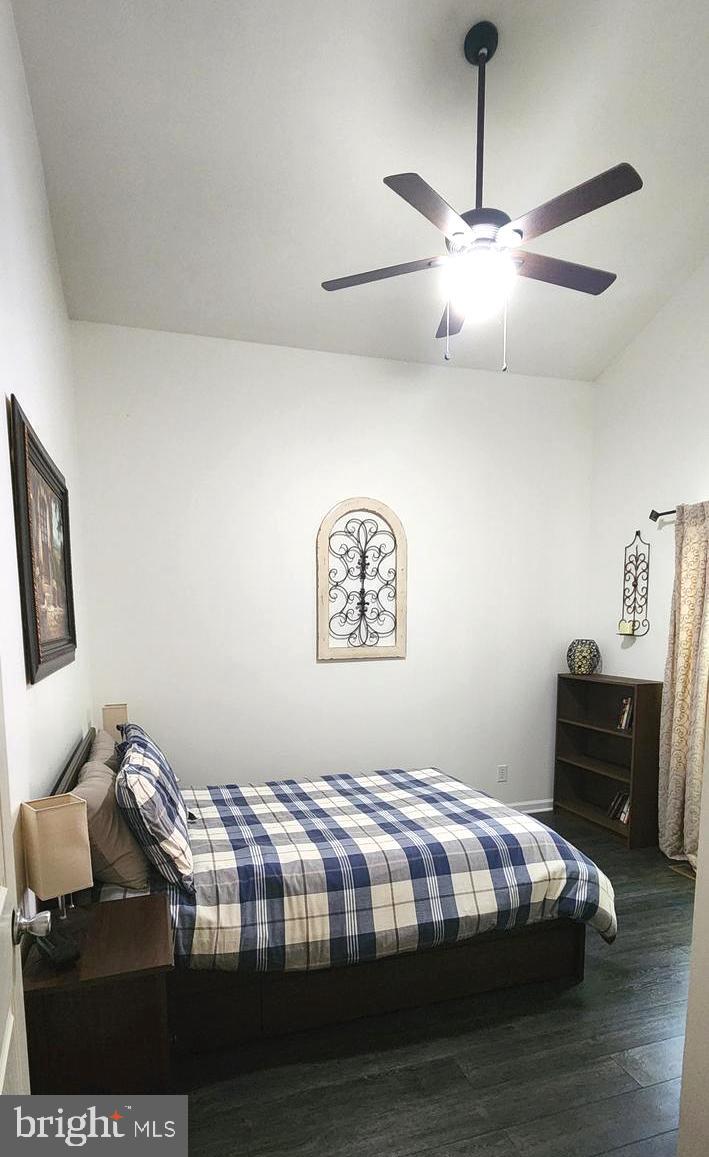 1112 Lee Road Basye, VA 22810 - Photo 41 of 102 a bedroom with a bed and wooden floor