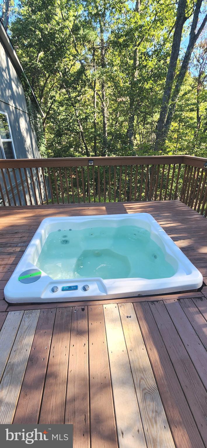 1112 Lee Road Basye, VA 22810 - Photo 75 of 102 a view of a swimming pool with an outdoor space and seating area