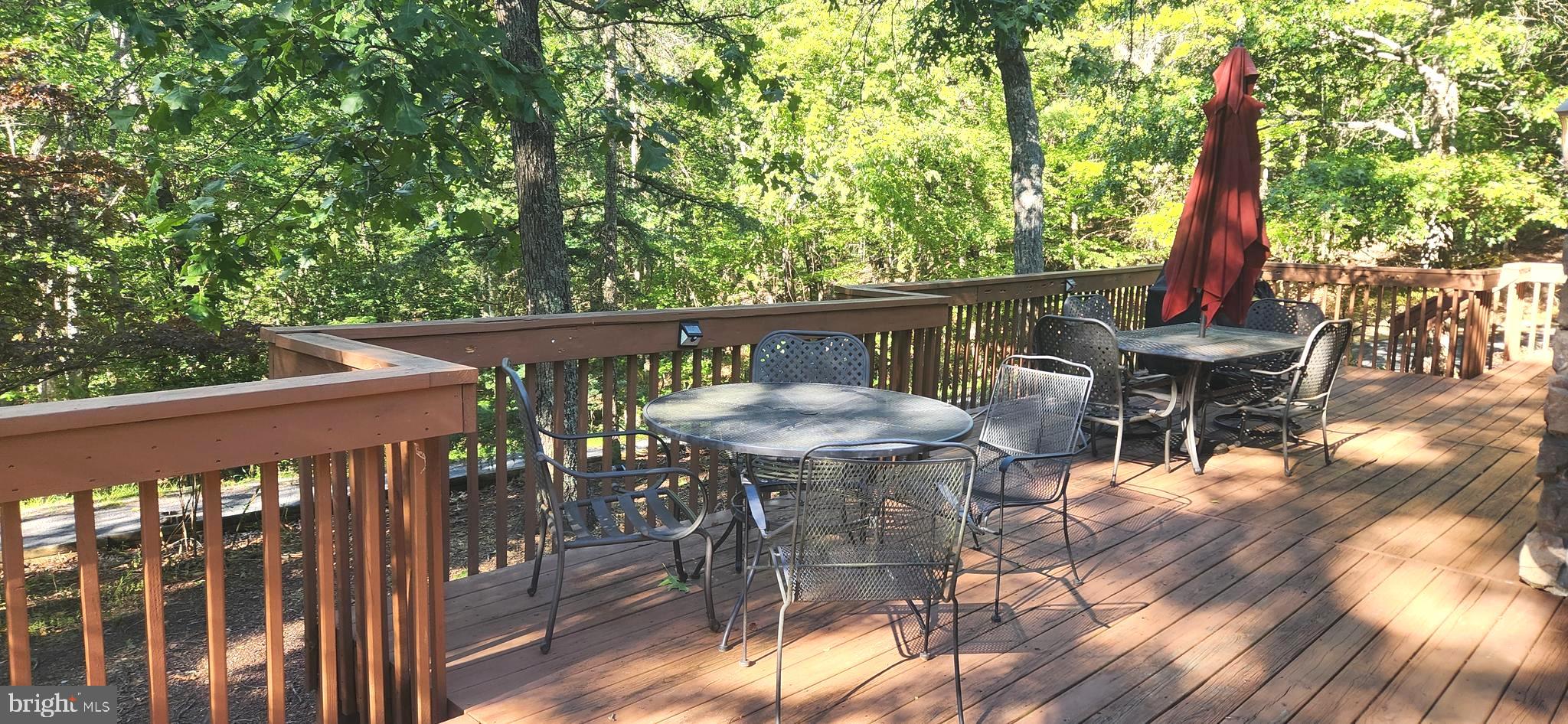 1112 Lee Road Basye, VA 22810 - Photo 77 of 102 a view of a chairs and table in patio with wooden fence