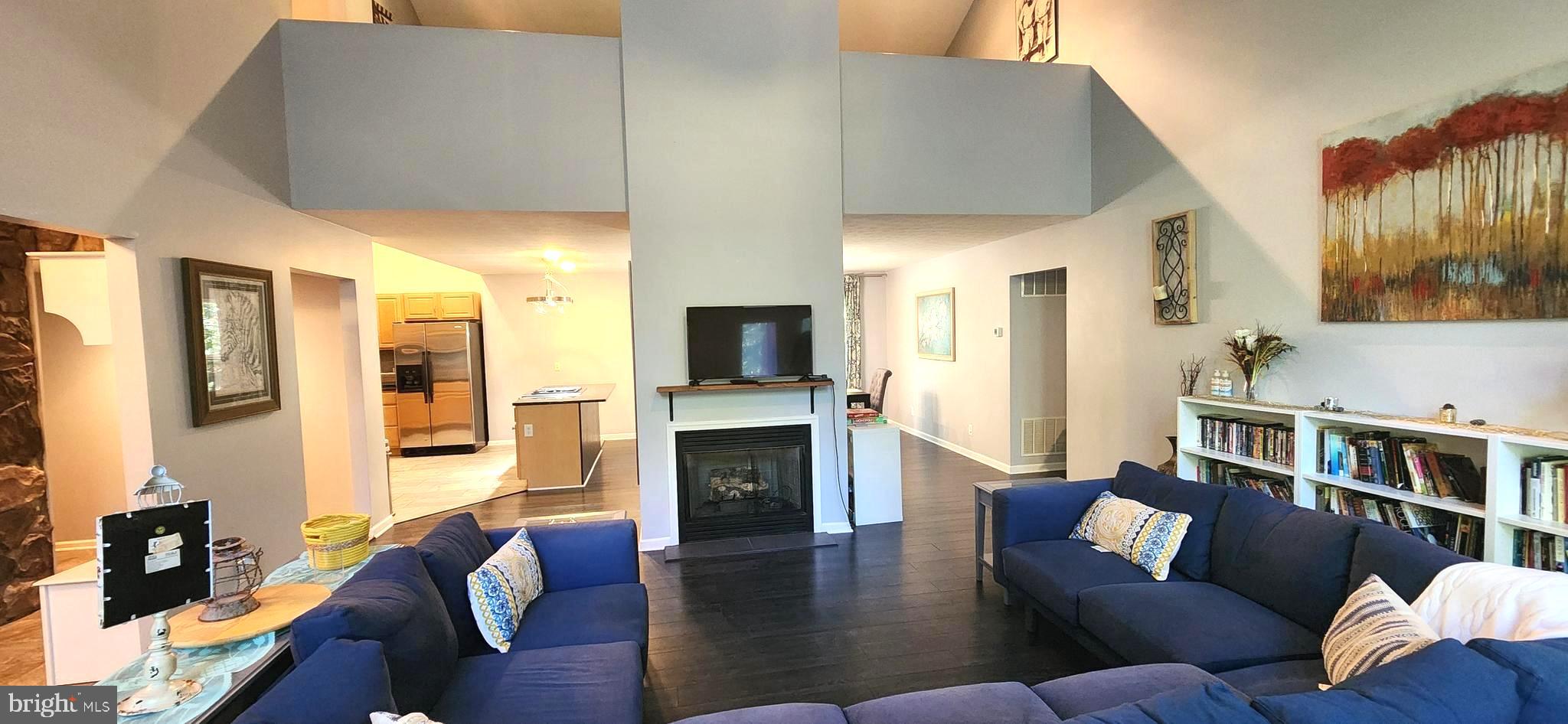 1112 Lee Road Basye, VA 22810 - Photo 9 of 102 a living room with furniture flat screen tv and a fireplace