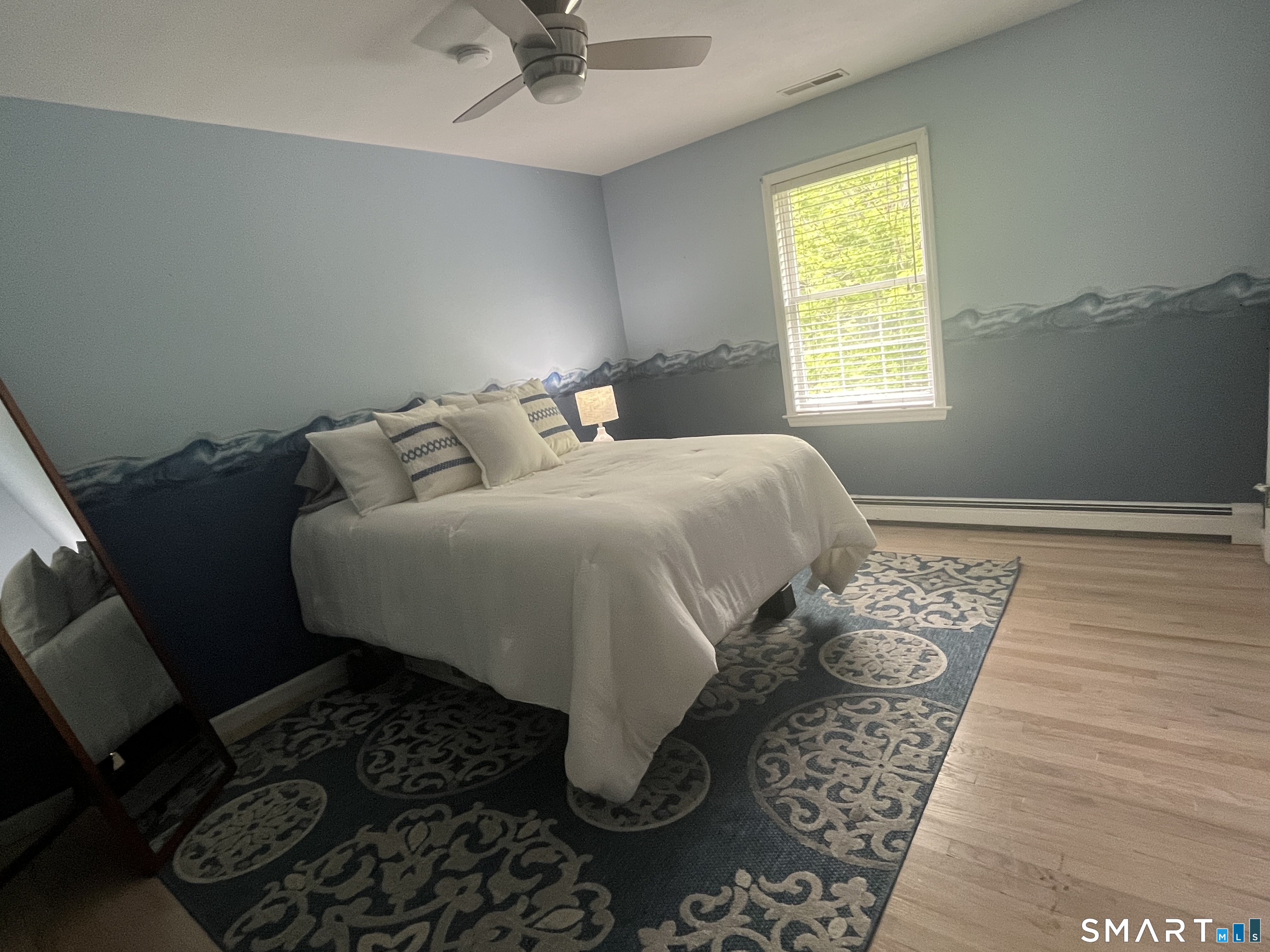 47 Merwin Brook Road Brookfield, CT 06804 - Photo 15 of 29 a bed sitting in a bedroom next to a window