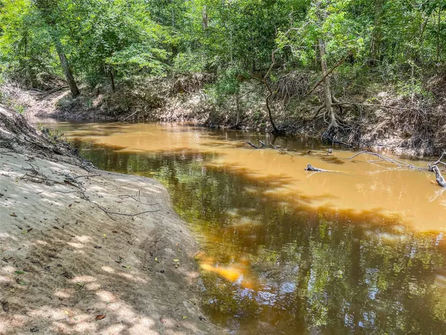 a view of a swimming pool with an outdoor space and seating area