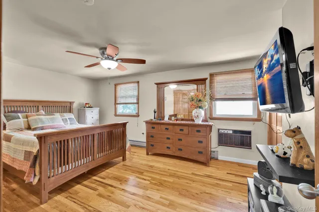 a bedroom with furniture and a window