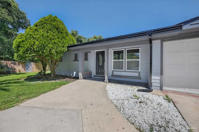 front view of a house with a yard