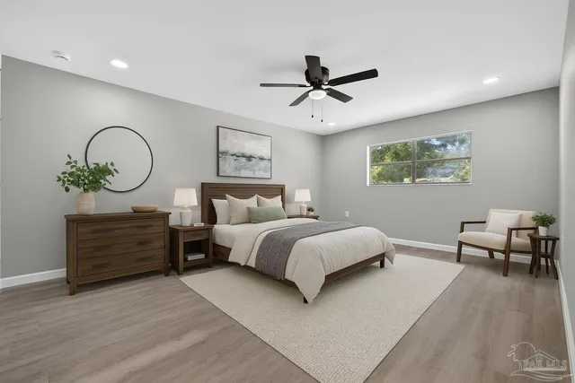 a bedroom with bed and furniture