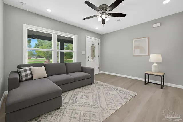 a living room with furniture and a window