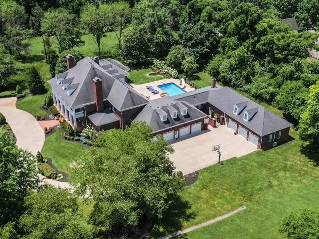 a front view of a building with a garden