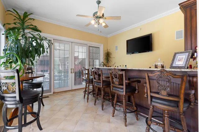 a dining room with furniture and window