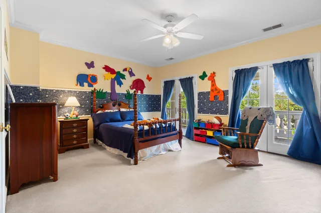 a living room with furniture pool table and window