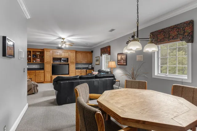 a bedroom with furniture and a ceiling fan
