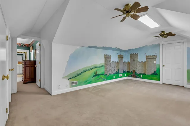 a kitchen with stainless steel appliances granite countertop a stove a refrigerator and a sink