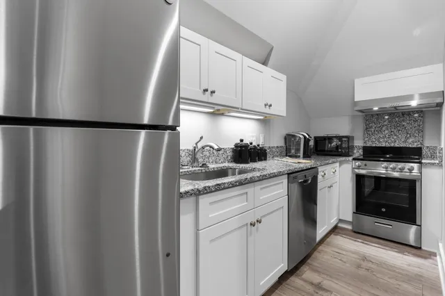 an aerial view of a house with garden space sitting space and swimming pool